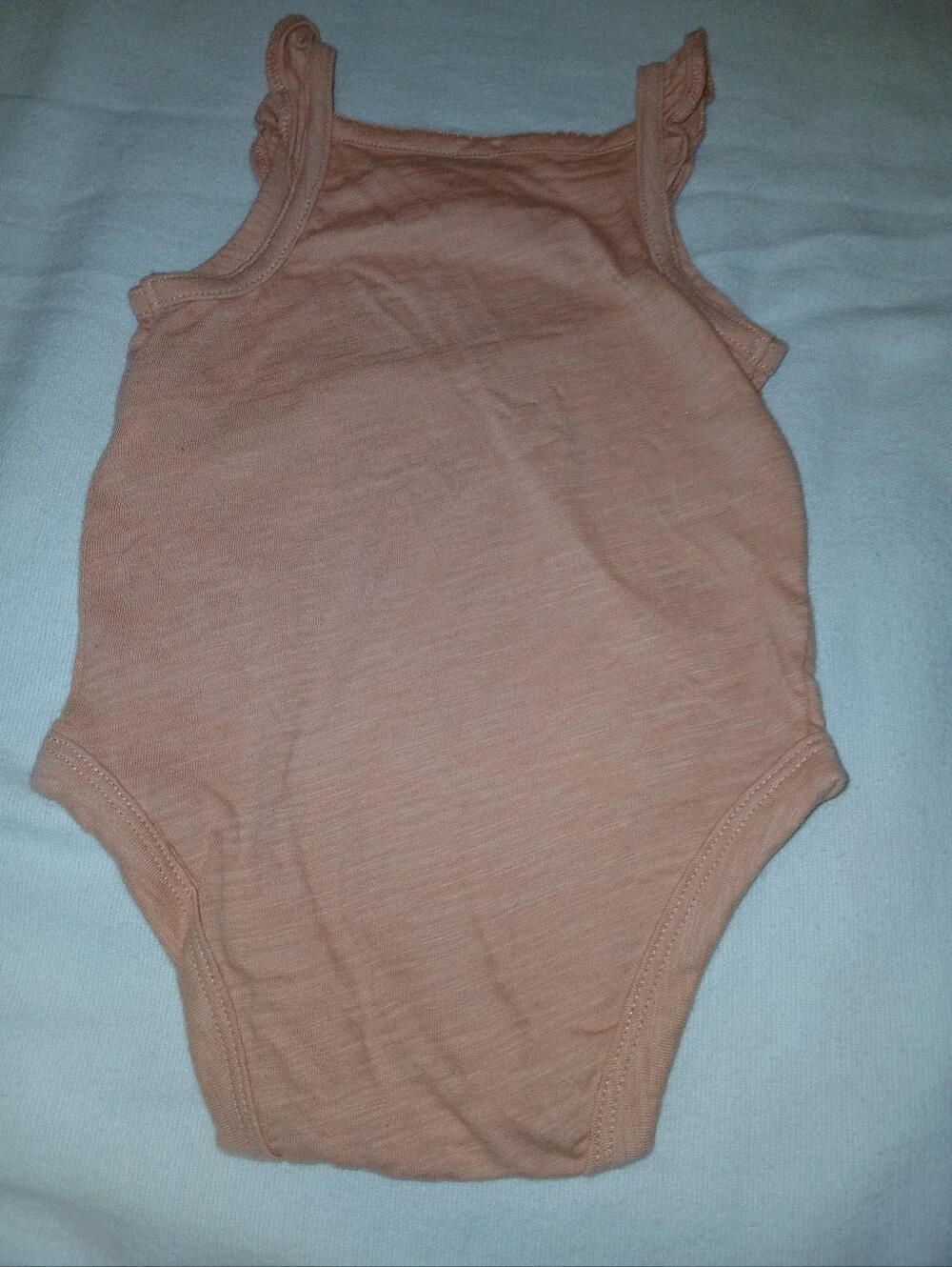 NWOT Sleeveless Peach Baby One-Piece Bodysuit.